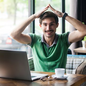 Happy guy in front of a safe computer!